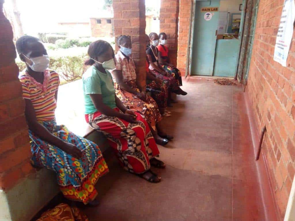 Women waiting outside of St. Francis Hospital in Katete, Zambia.