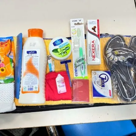Hygiene kit containing soap, sandles, comb, toothpaste, hand cream, underwear, mirror, etc.