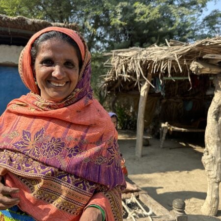 Sabhagi stands outside of her home, after returning from a successful fistula surgery.