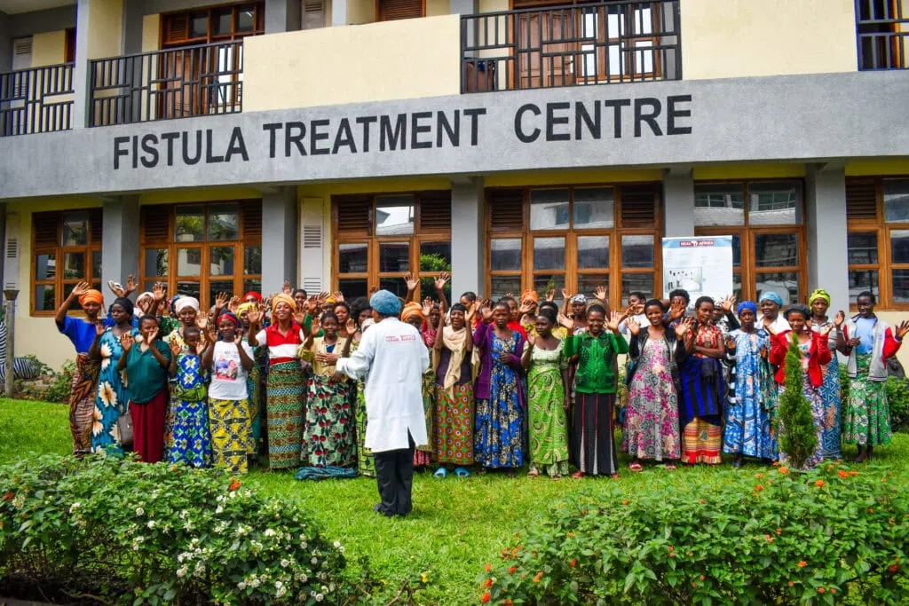 A group of fistula survivors and staff gather outside of HEAL Africa in Goma, Democratic Republic of Congo.